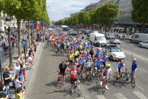 London to Paris Bike Ride group on the Champs Elysses